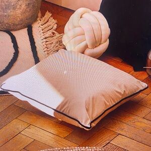Beige Cushion with Black Trim